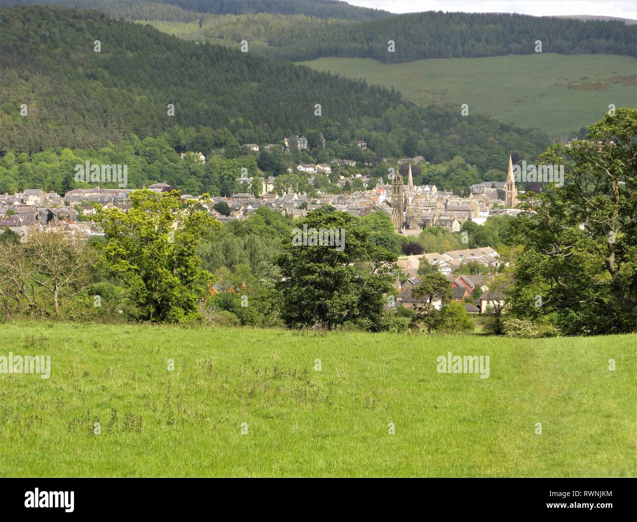 View over the town of Peebles situated in a green valley in the Scottish Borders, Scotland Stock Photo