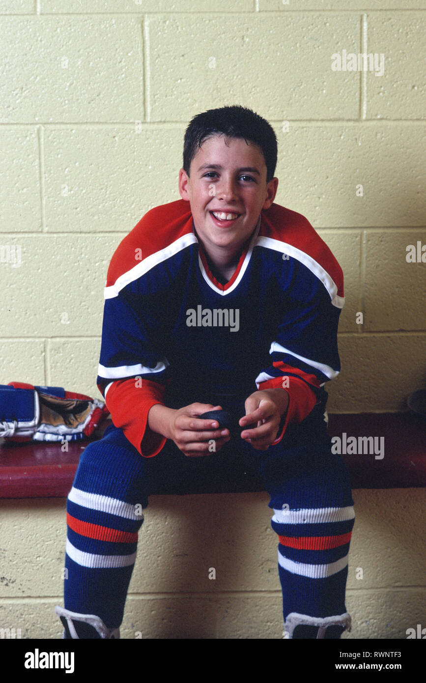 Hockey Player in Locker room after Winning Game, 1990s, USA Stock Photo
