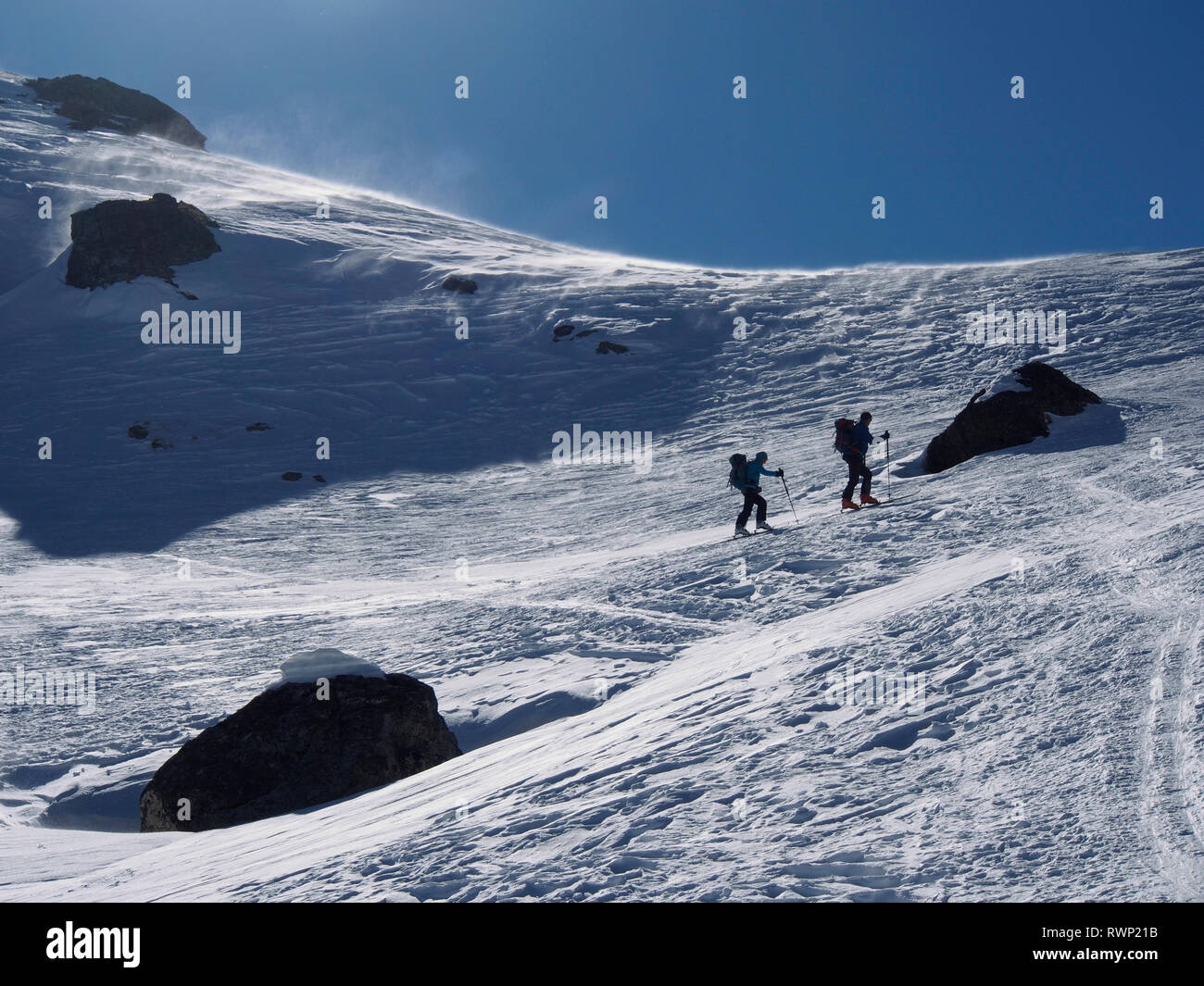 Ski mountaineers approaching Col de Longet, Parc regional du Queyras, French Alps Stock Photo