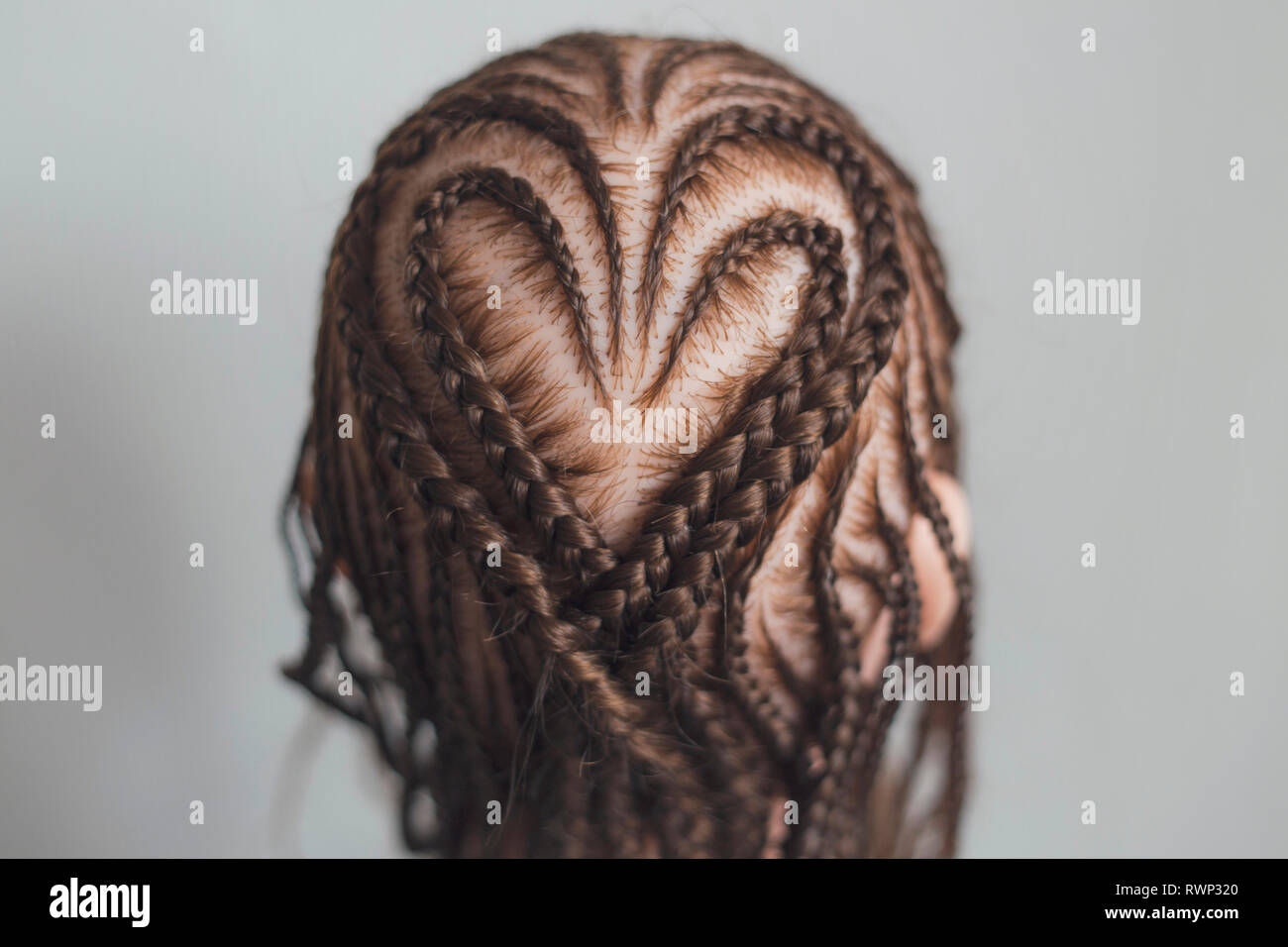 background pattern of braids, braided hair close-up, art, craftsman Stock Photo