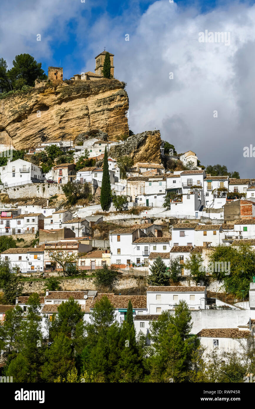 Ruins of a Moorish castle on a hilltop with white houses filling the hillside; Montefrio, Province of Granada, Spain Stock Photo