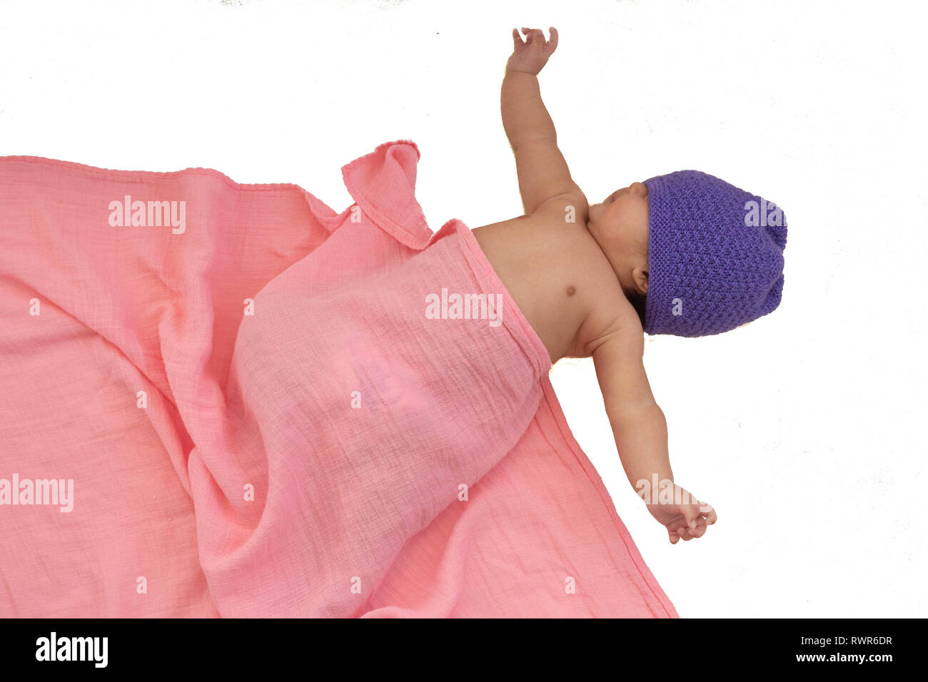 Infant in purple cap Stock Photo