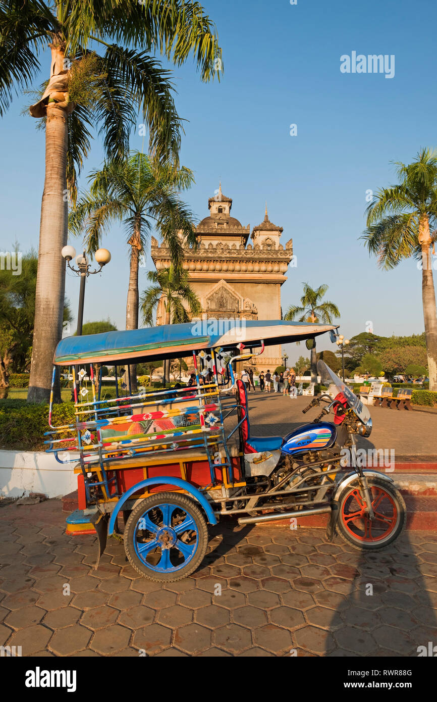 Tuk tuk at Patuxai Victory Monument Vientiane Laos Stock Photo