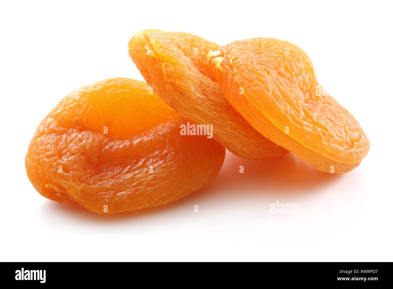 Dried golden apricots isolated on white background Stock Photo - Alamy