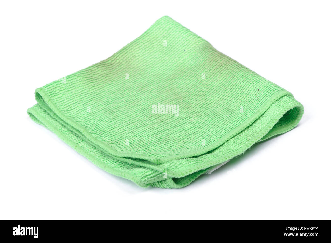 Folded green microfiber cloth isolated on white background Stock Photo