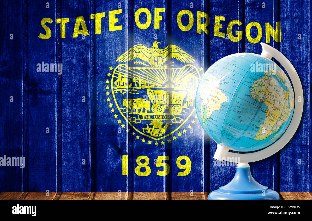 Globe With A World Map On A Wooden Background With The Image Of The Globe With A World Map On A Wooden Background With The Image Of The Flag State Of Oregon The Concept Of Travel And Leisure Abroad RWRR35 