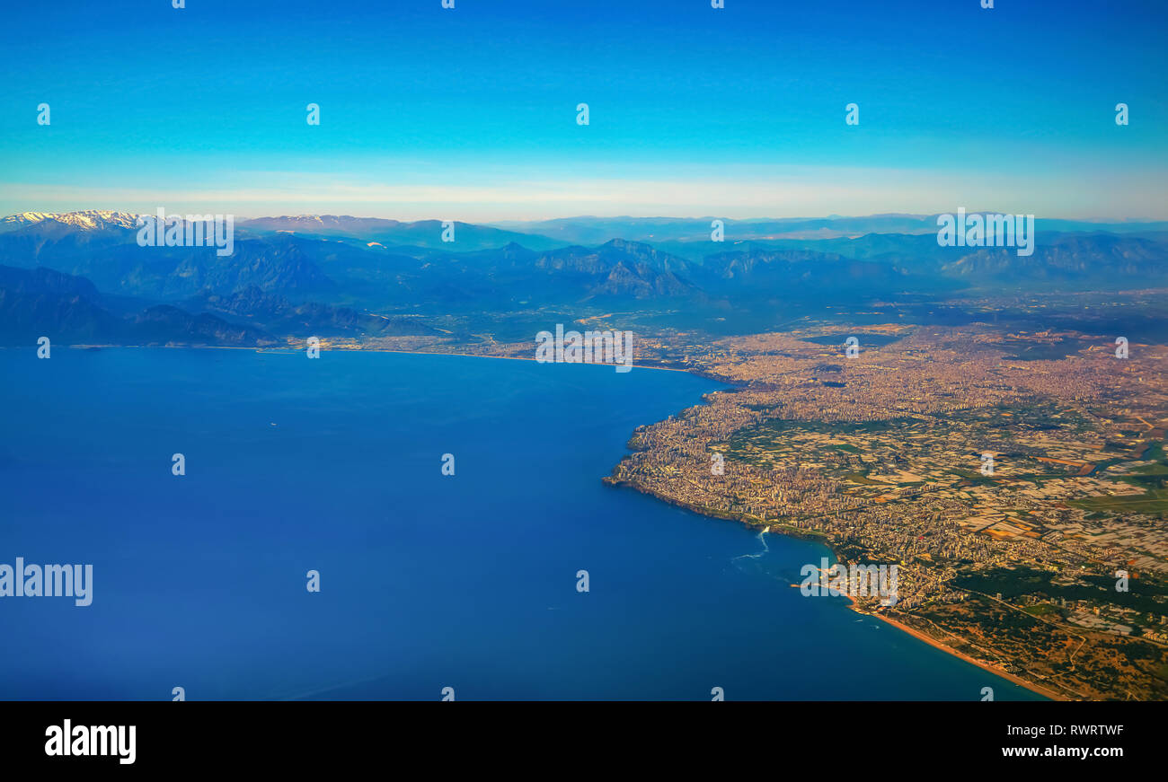 Blurred Antalya bay in Turkey from airplane windows Stock Photo