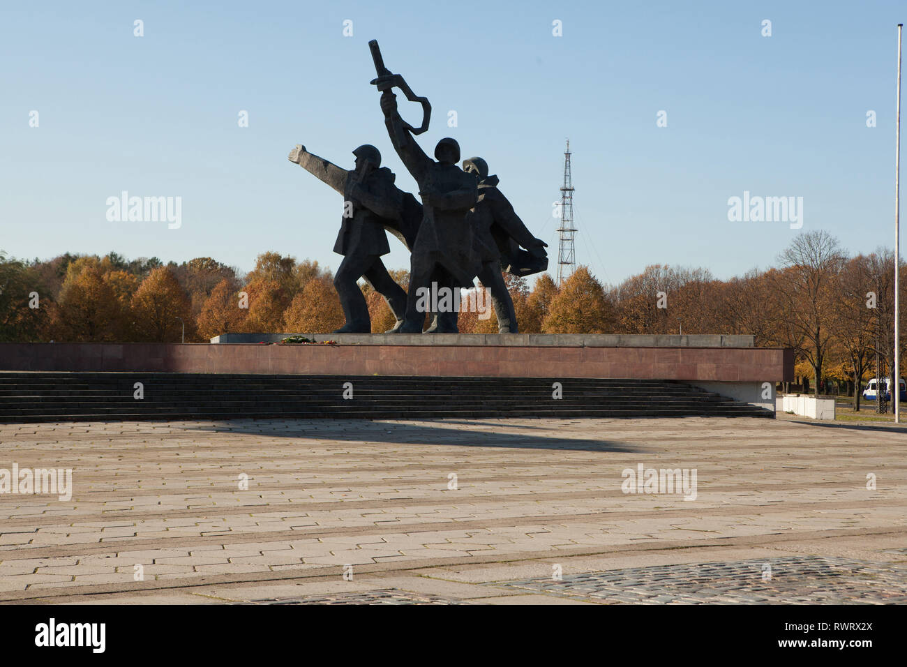 War memorial of soldiers celebrating in parkland, Latvia Stock Photo