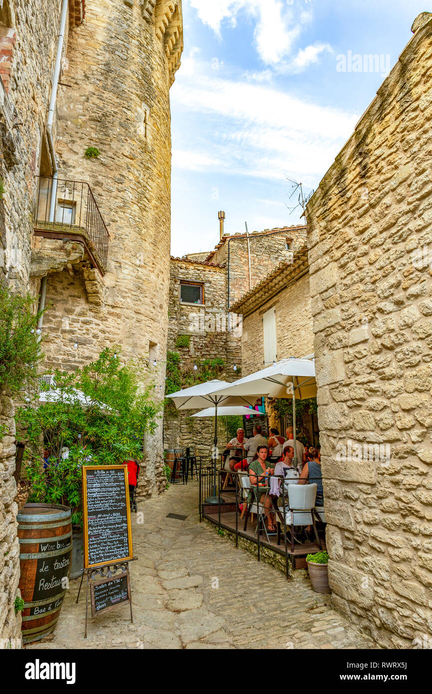 France. Vaucluse (84), Regional Natural Park of Luberon. The village of Gordes classified most beautiful village of France. People Sitting resrtaurant Stock Photo