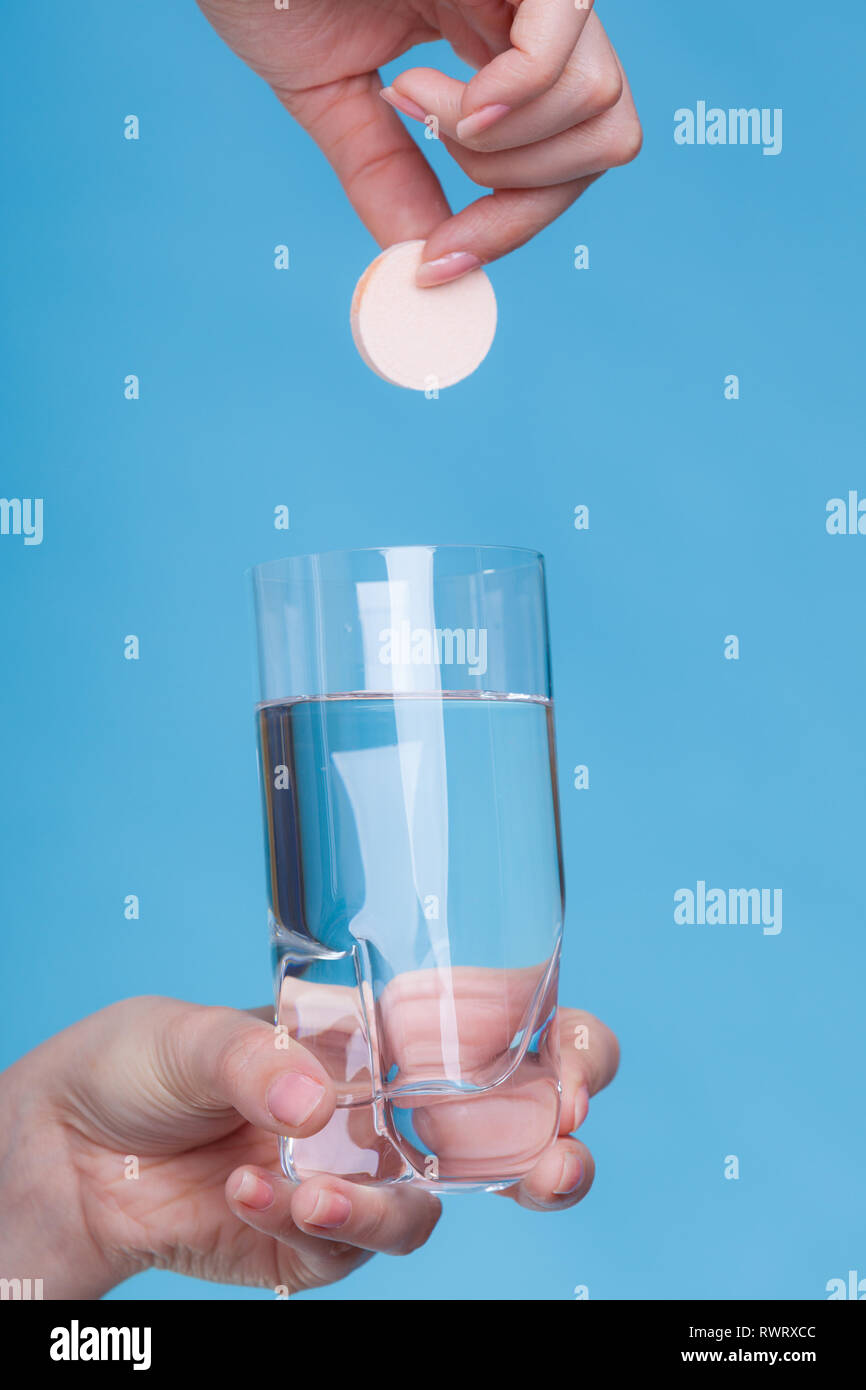 Vitamins, health, medicines. Person throwing vitamin mineral supplement