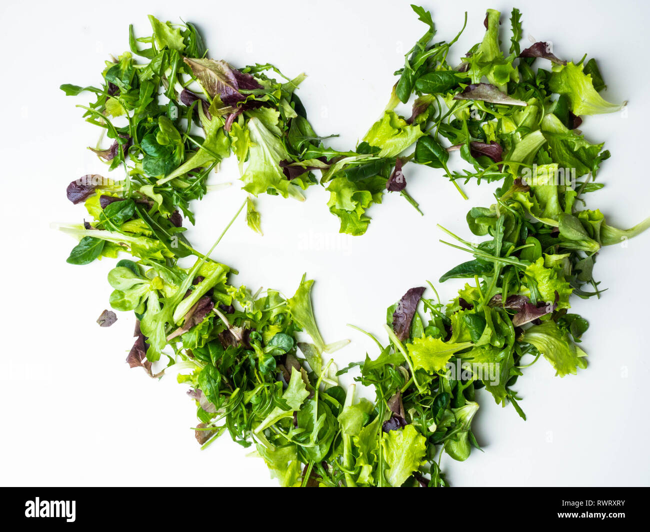 Mixed salad leaf. Lettuce spinach isolated on white background, heart