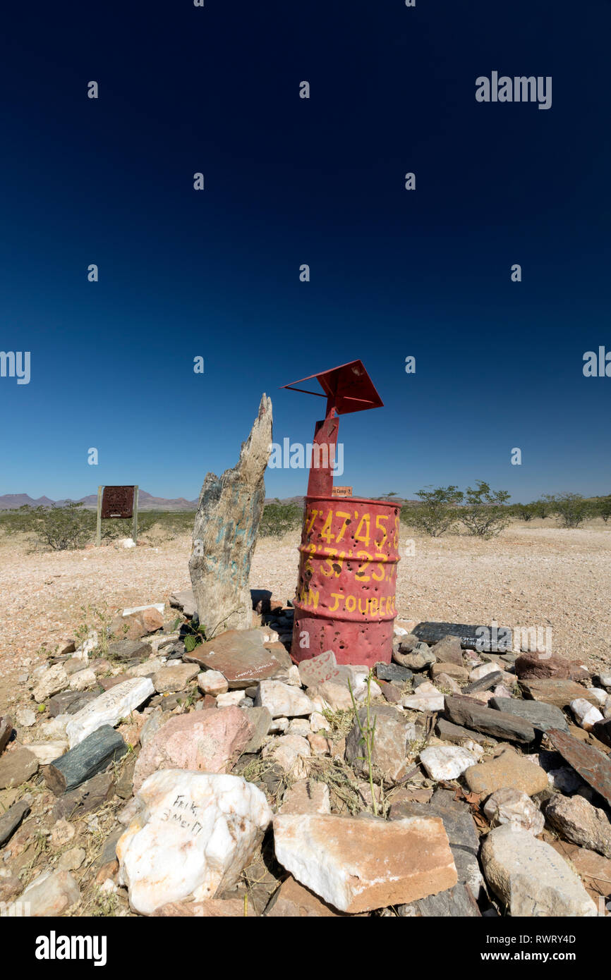 Red drum location marker in the vast wilderness of the Kunene Region, Namibia. Stock Photo