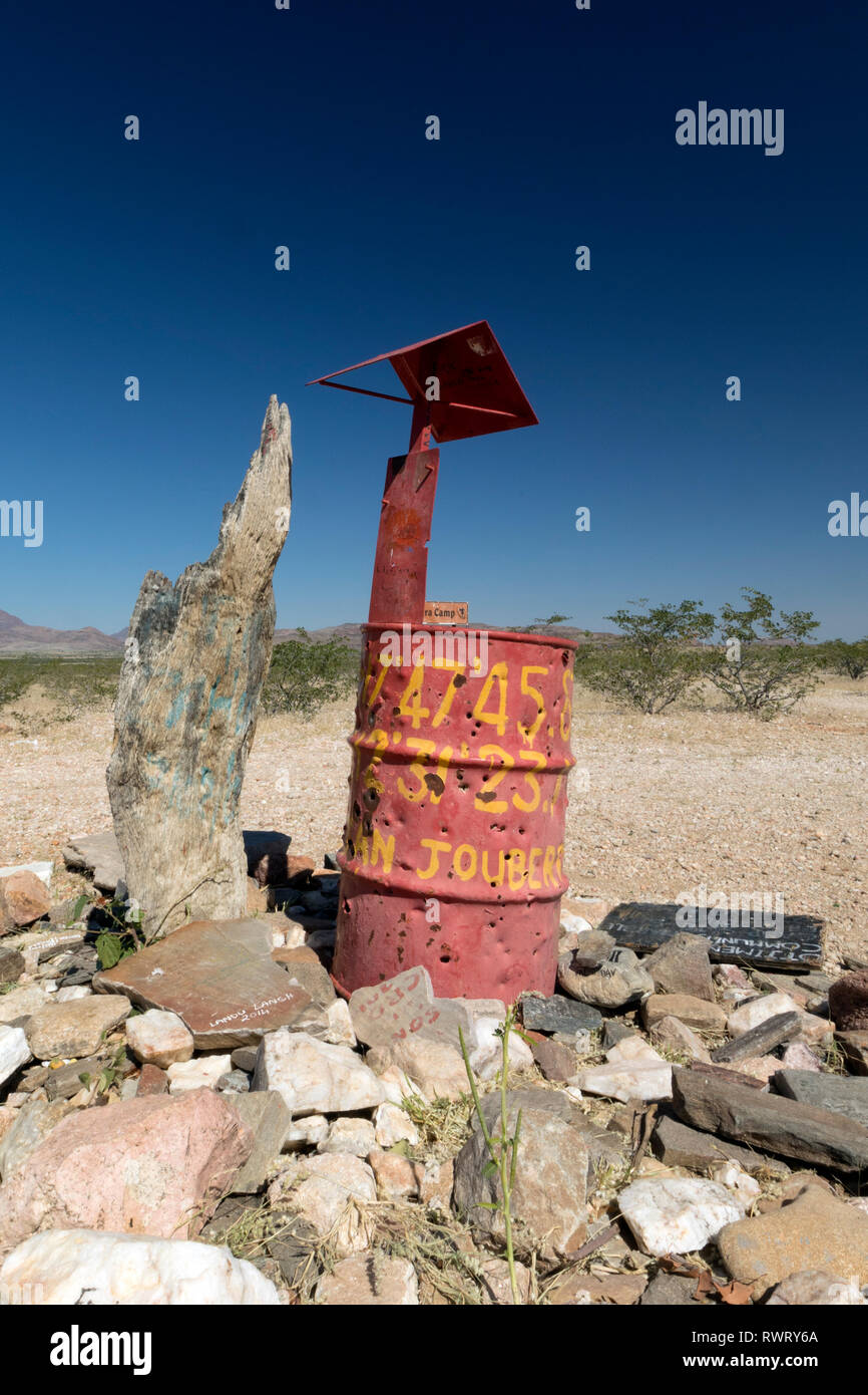 Red drum location marker in the vast wilderness of the Kunene Region, Namibia. Stock Photo