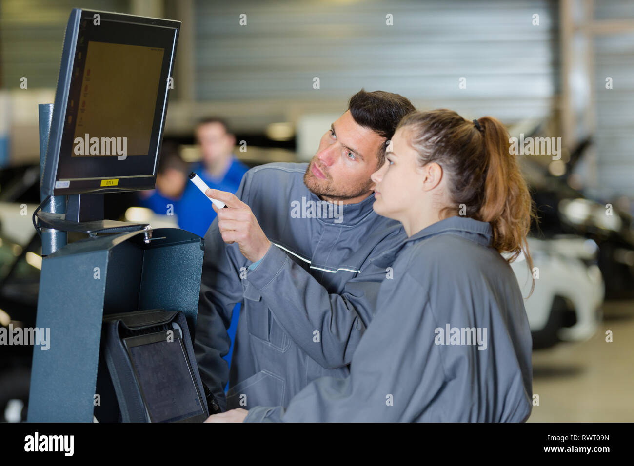 female mechanic running a diagnostics program Stock Photo Alamy