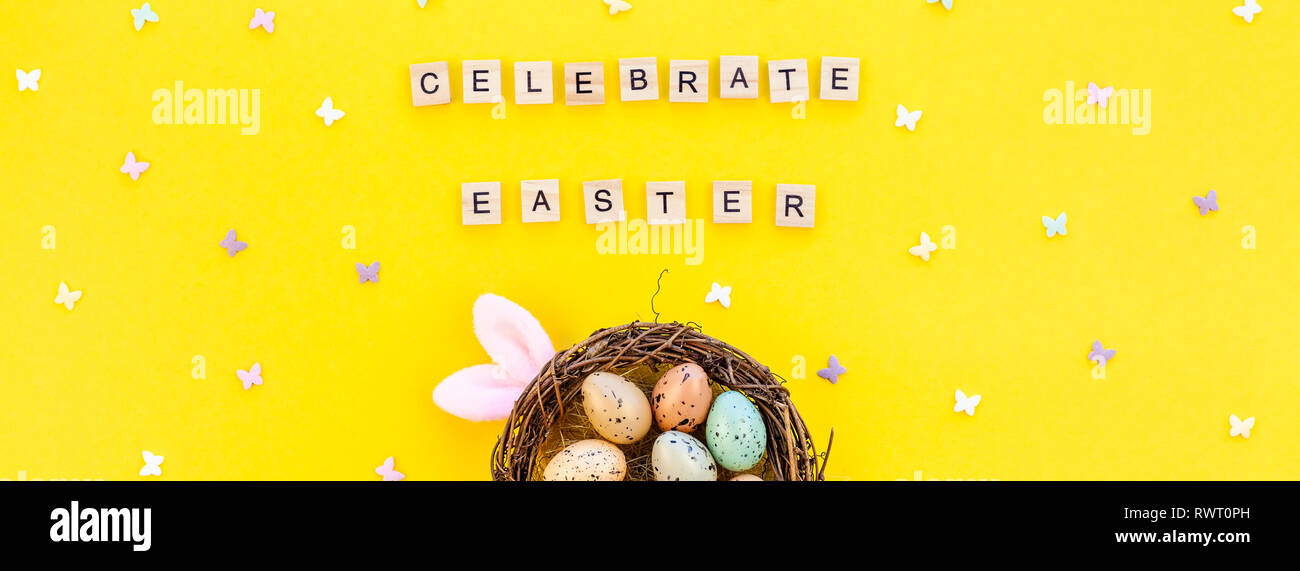 Creative Top view flat lay holiday composition Easter bunny ears eggs ...