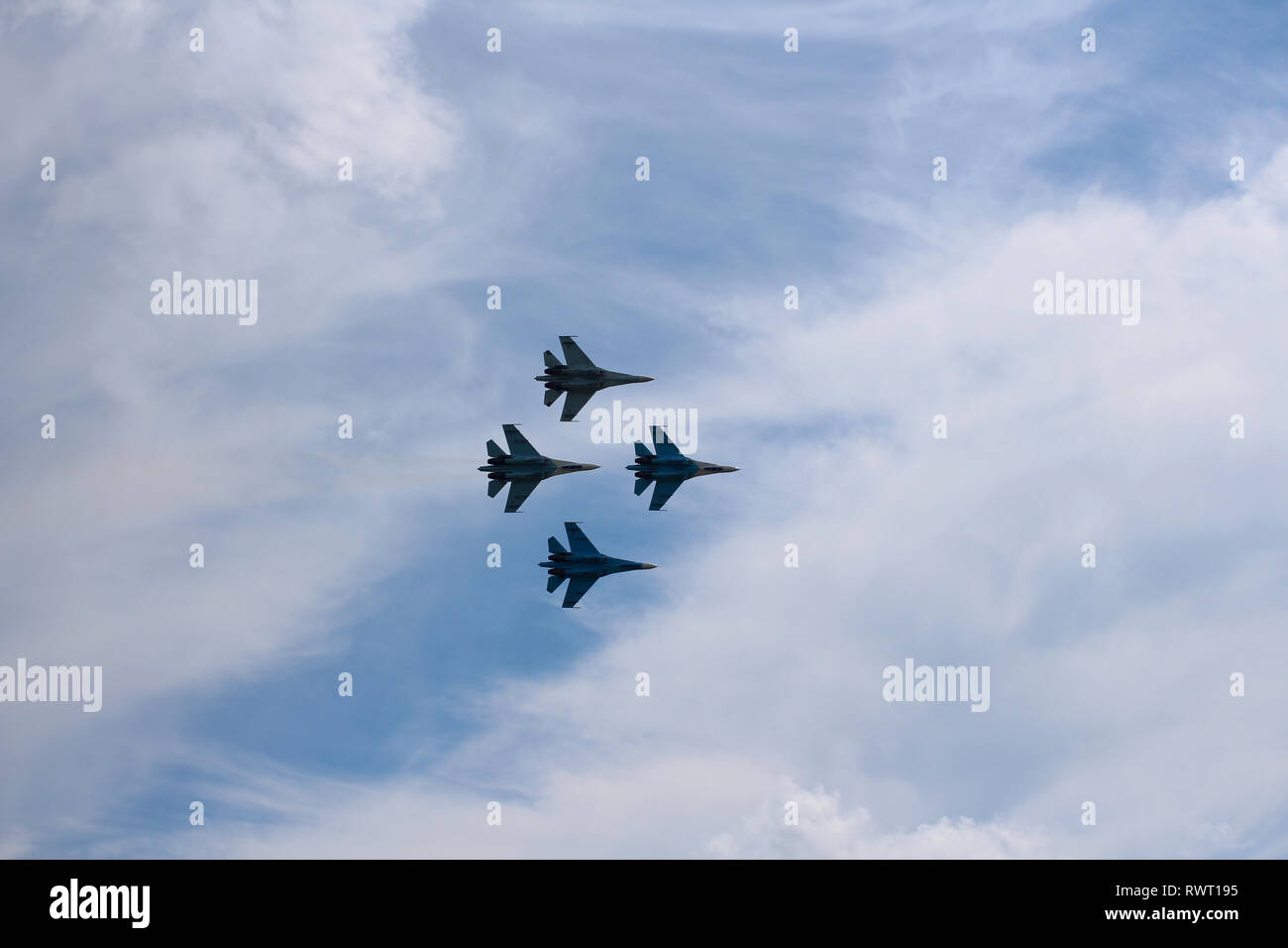 Four aircraft combat fighters SU-34 military fighters flying in the sky a great strong powerful Stock Photo