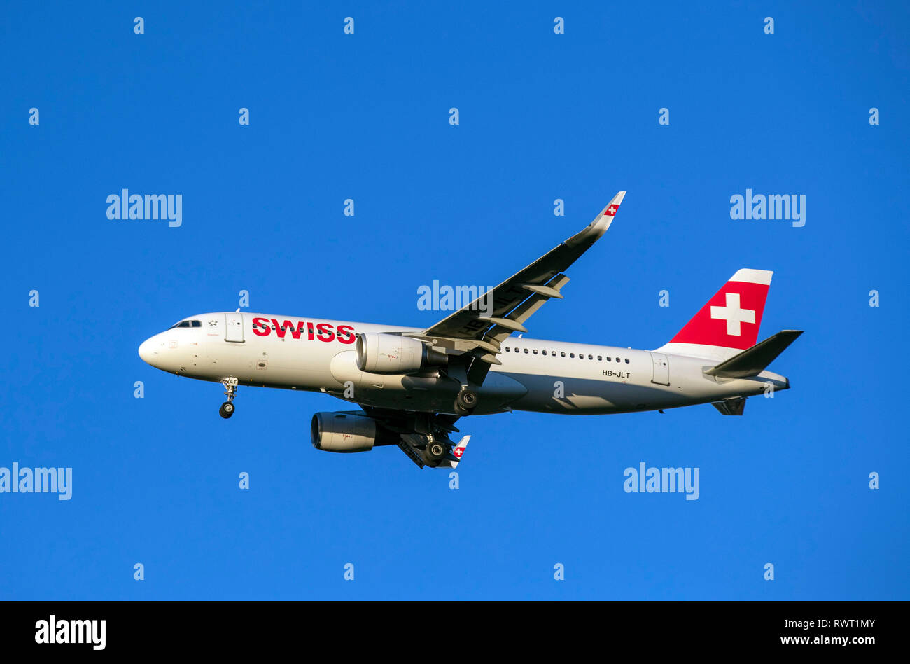 A Swiss International Airlines Airbus A320 plane lands at Heathrow Airport in West London. Stock Photo
