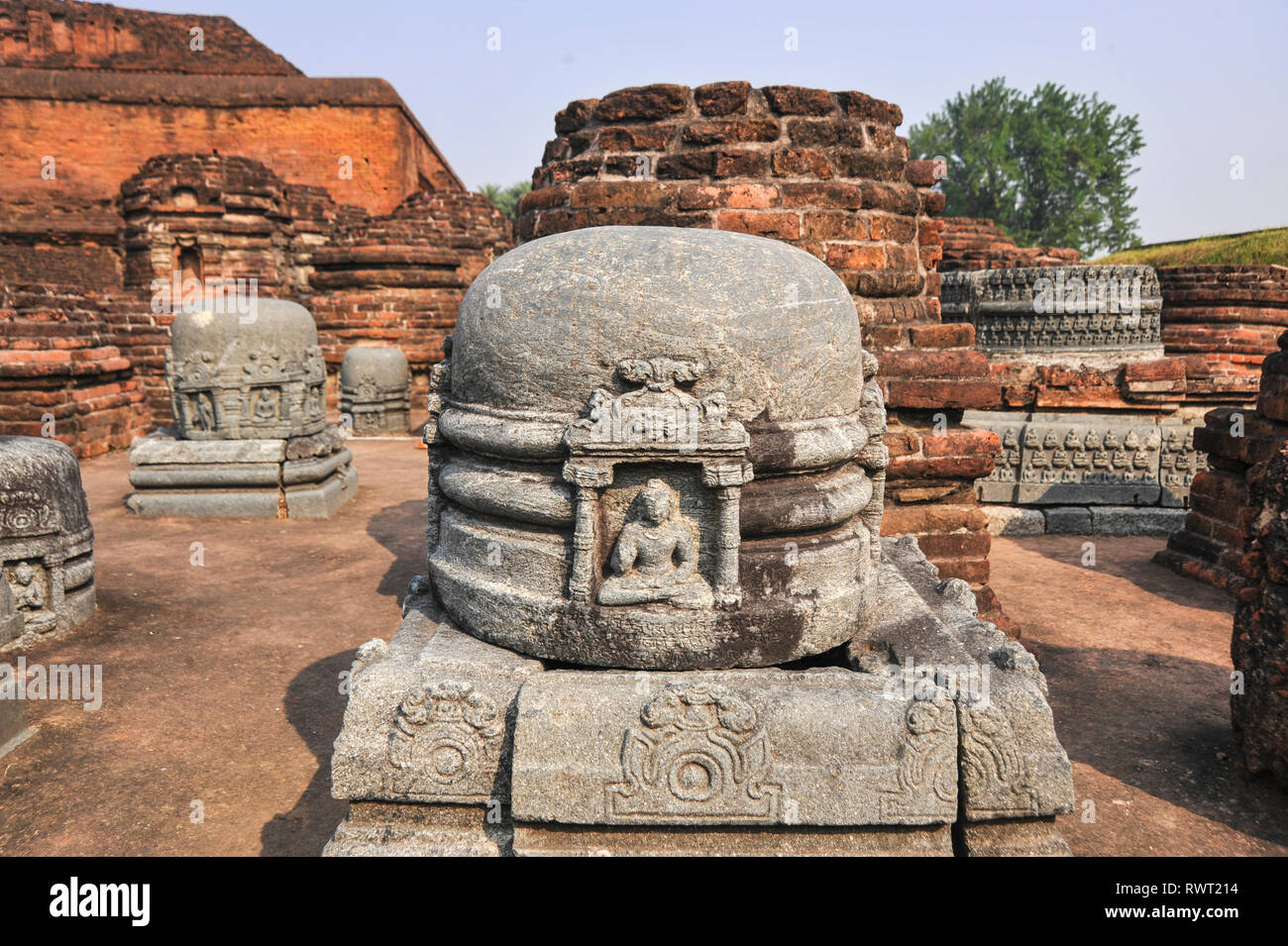 NALANDA, BIHAR, INDIA, small stupas with relief of Buddha Stock Photo