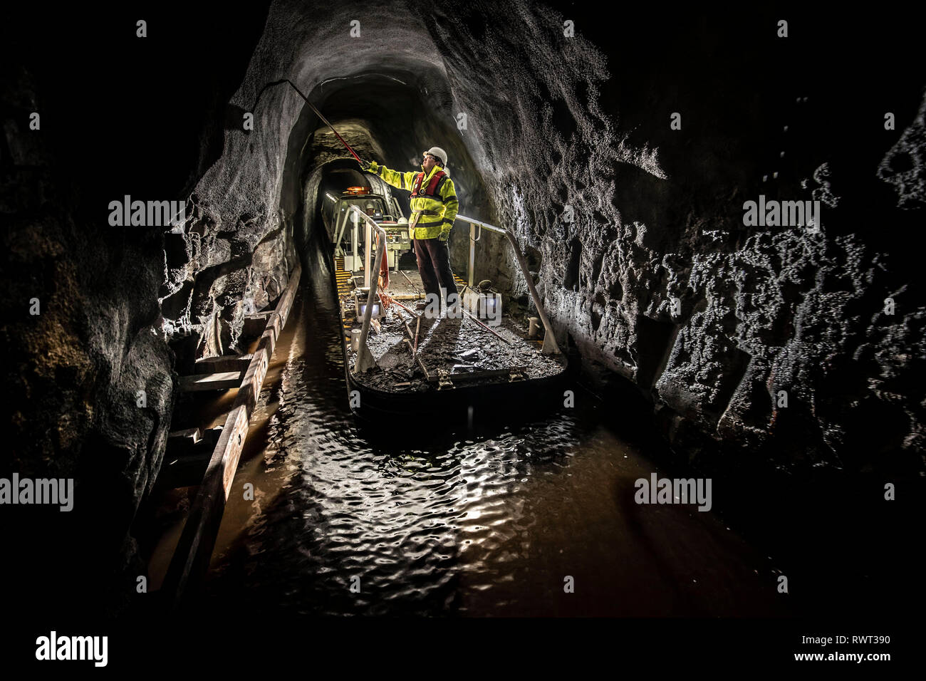 A member of the Canal & River Trust inspecting the Standedge Tunnel on the Huddersfield Narrow Canal. Stock Photo
