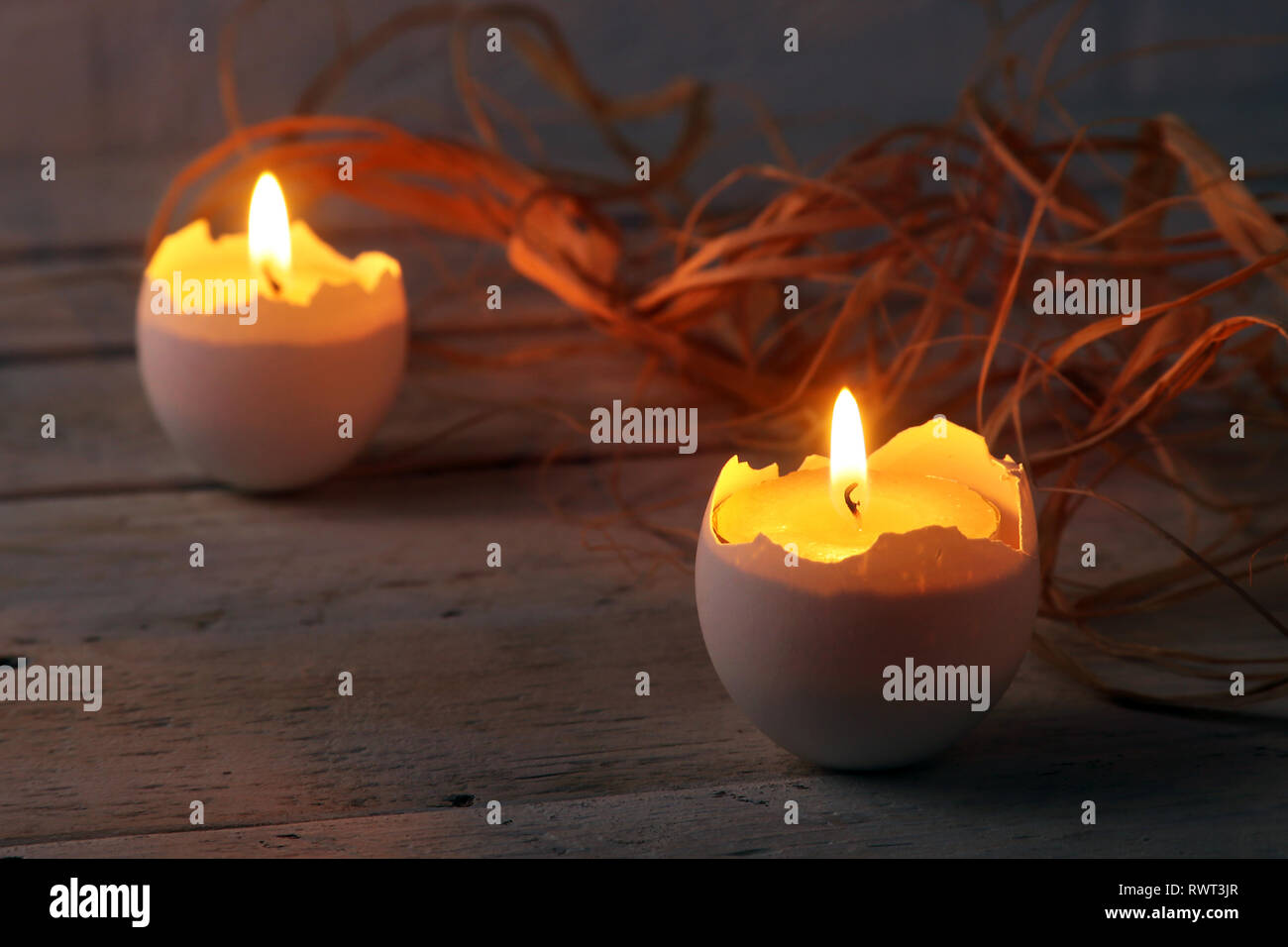 Happy easter composition with eggs and candles on Rustic background. Selective focus. Stock Photo