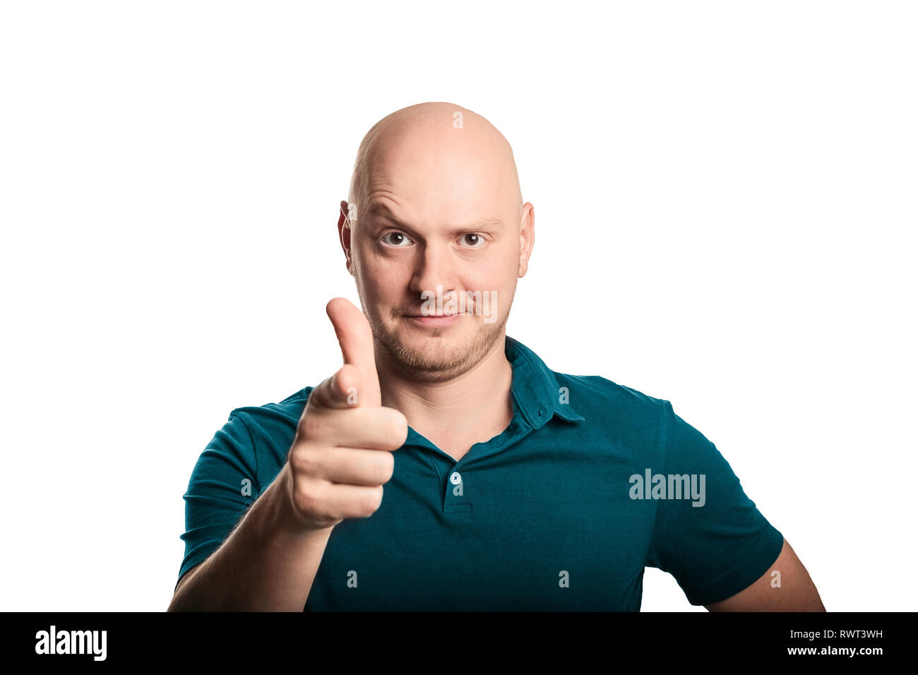 Young man with blue shirt pointing finger to the camera, feeling confident. Studio shot on a white background Stock Photo