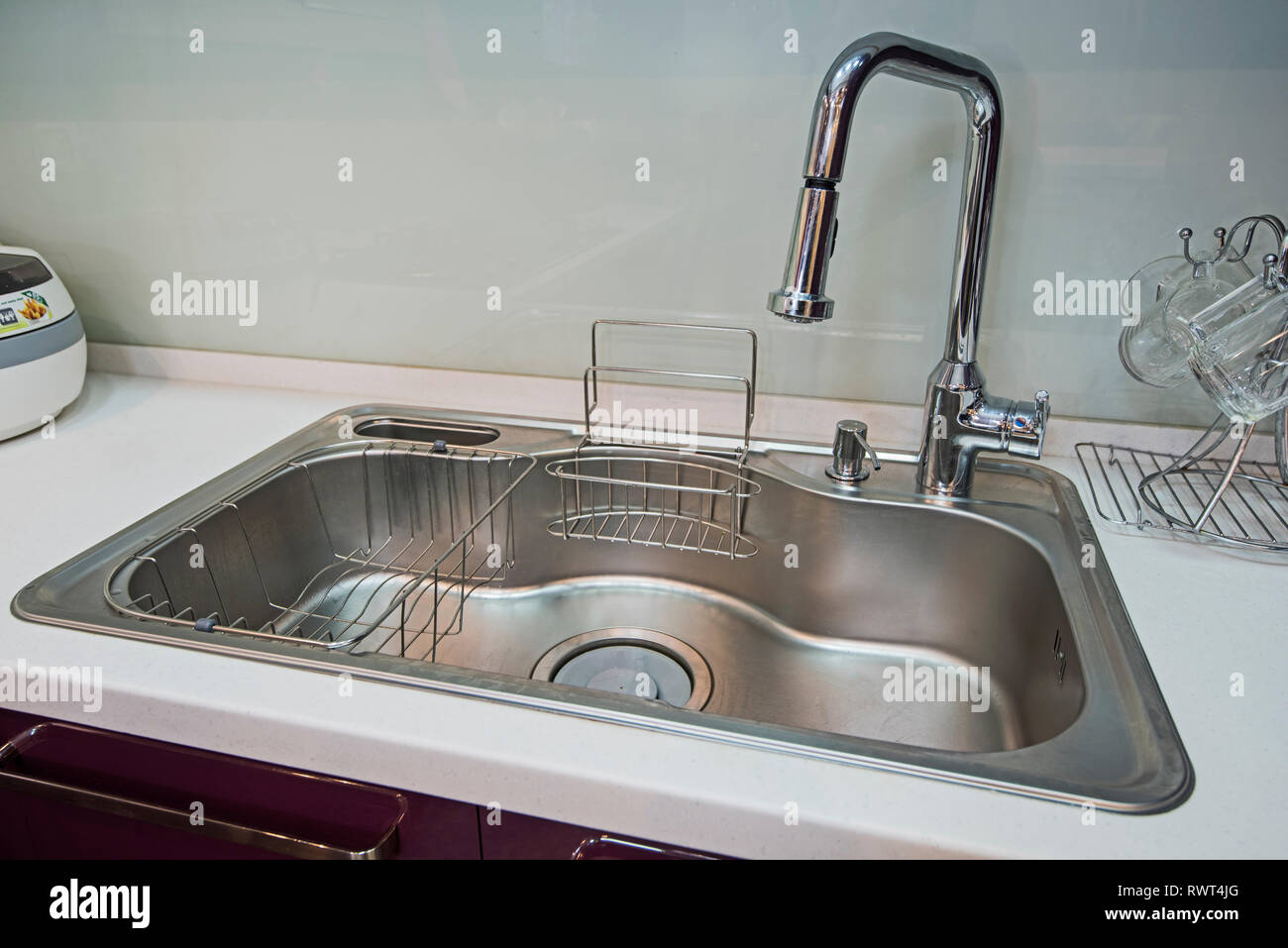 Interior design decor showing modern kitchen sink in luxury apartment showroom Stock Photo