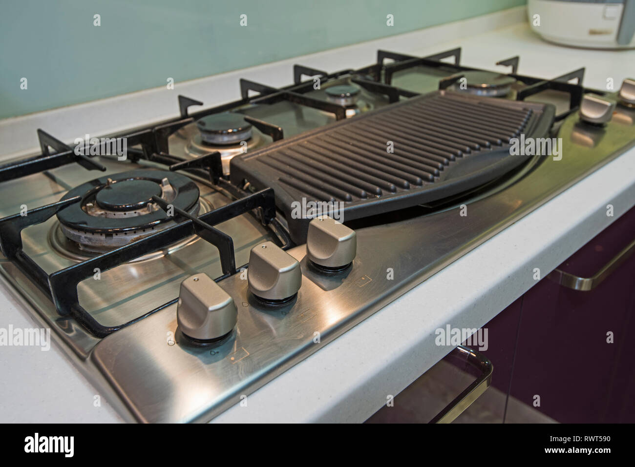 Interior design decor showing modern kitchen cooker hob appliance in luxury apartment showroom Stock Photo