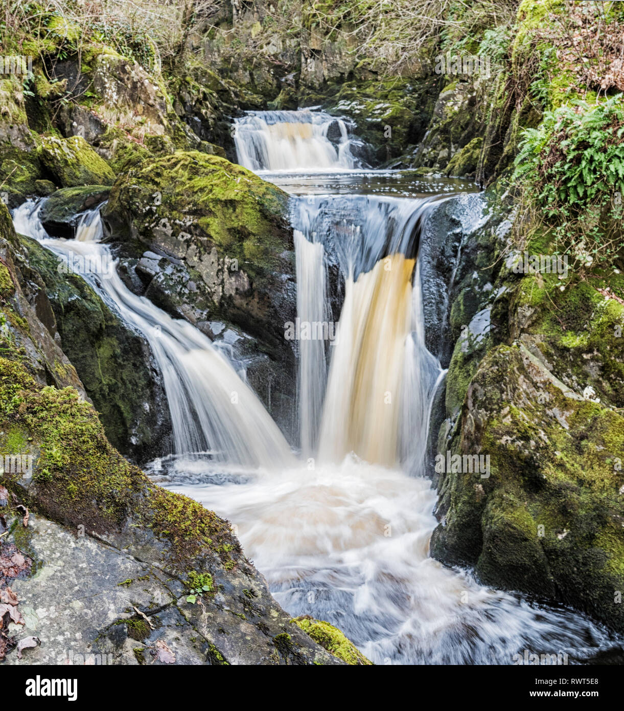 Multiple levels of the Pecca falls on the popular Ingleton waterfall trail in the North Yorkshire Dales England UK. Stock Photo