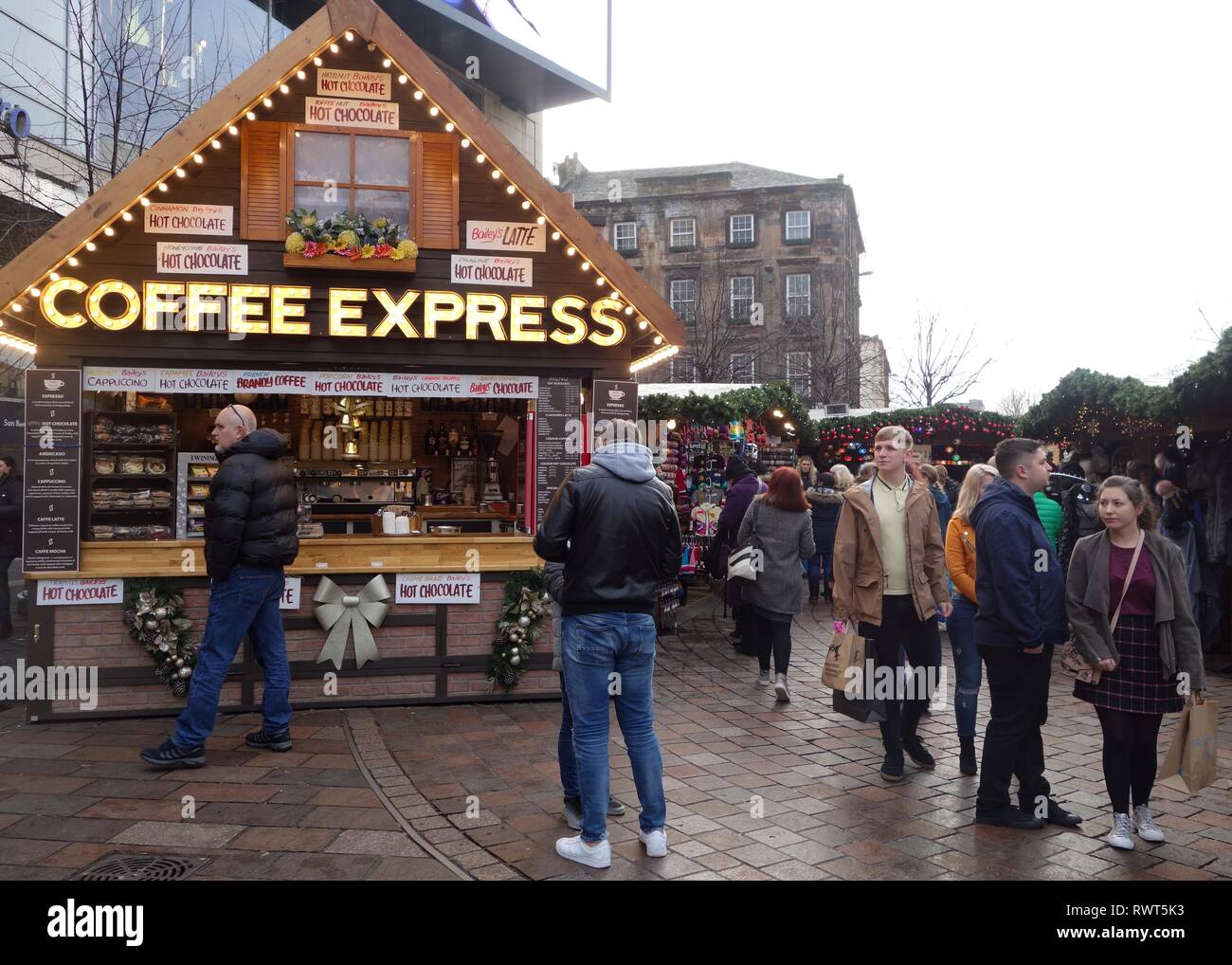 People wandering round enjoying the Christmas market stalls in St. Enoch Square, Glasgow, Scotland, UK, Europe Stock Photo