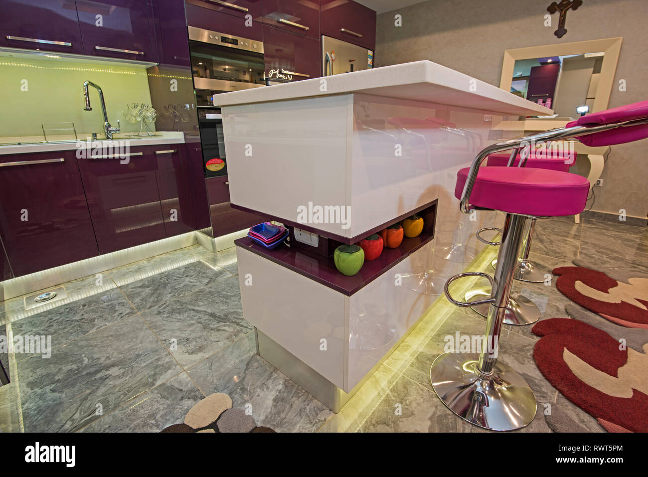 Interior design decor showing modern kitchen island breakfast bar in luxury apartment Stock Photo