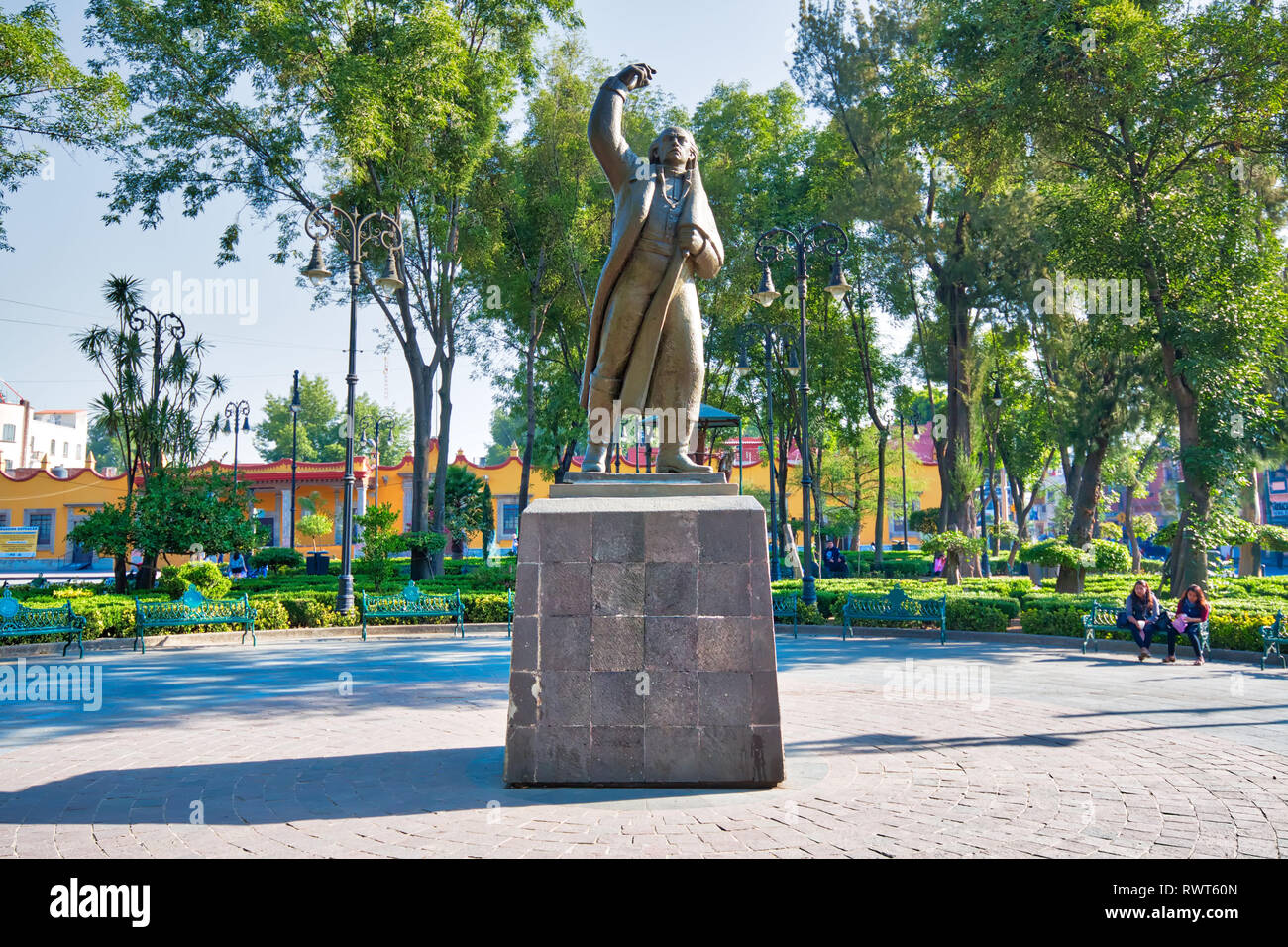Coyoacan, Mexico City, Mexico-20 April, 2018: Miguel Hidalgo Statue in front of Parish of San Juan Bautista on Hidalgo square in Coyoacan Stock Photo