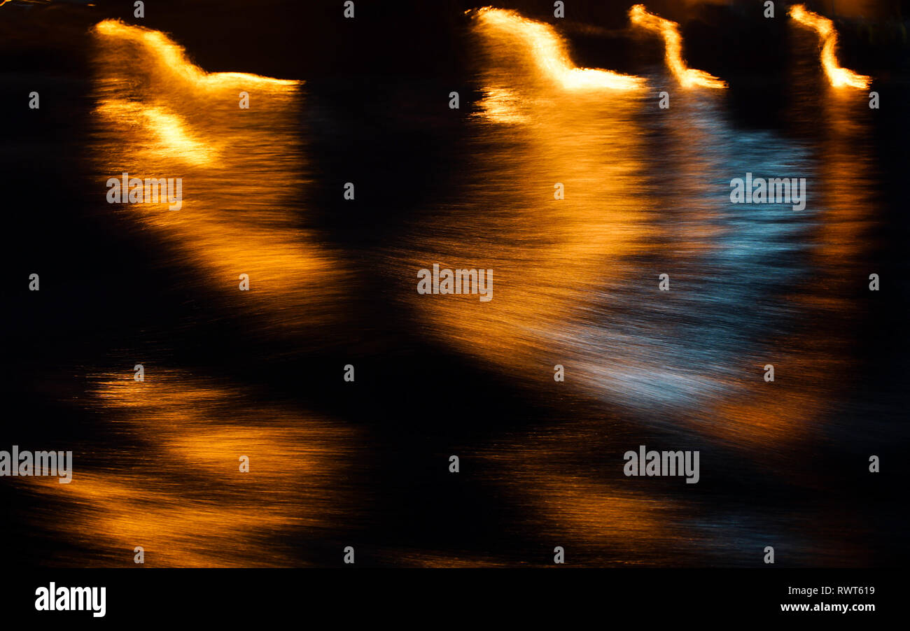 Abstract shapes on water surface at night Stock Photo