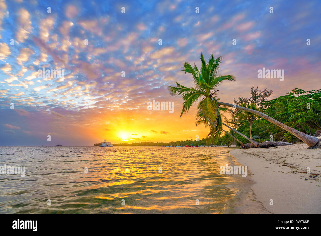 Sunrise over tropical beach Stock Photo - Alamy