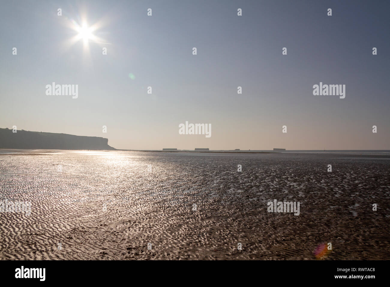 View Across The Beach At Low Tide On A Bright Evening On The