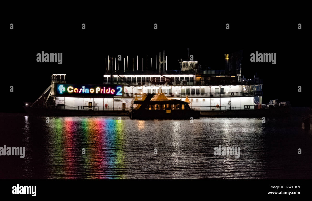 Very Famous Casino Pride 2 vessel anchored in the Mandovi River during night. A famous tourist attraction for legal betting and gambling. Stock Photo