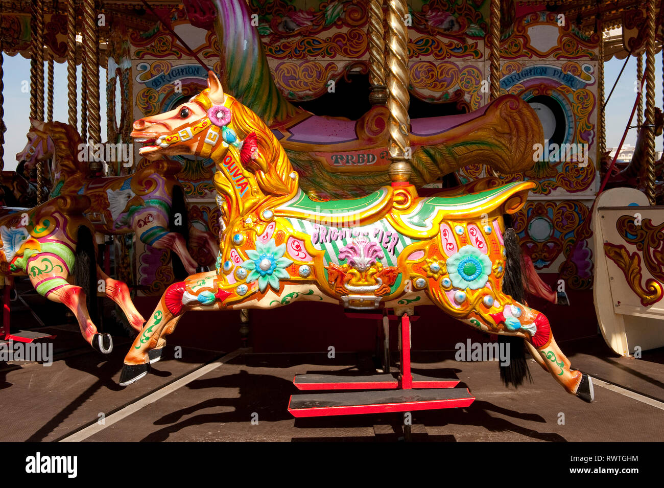 Painted horse on a carousel on the Brighton Palace pier,  in the coastal town of Brighton, Sussex, England. Stock Photo