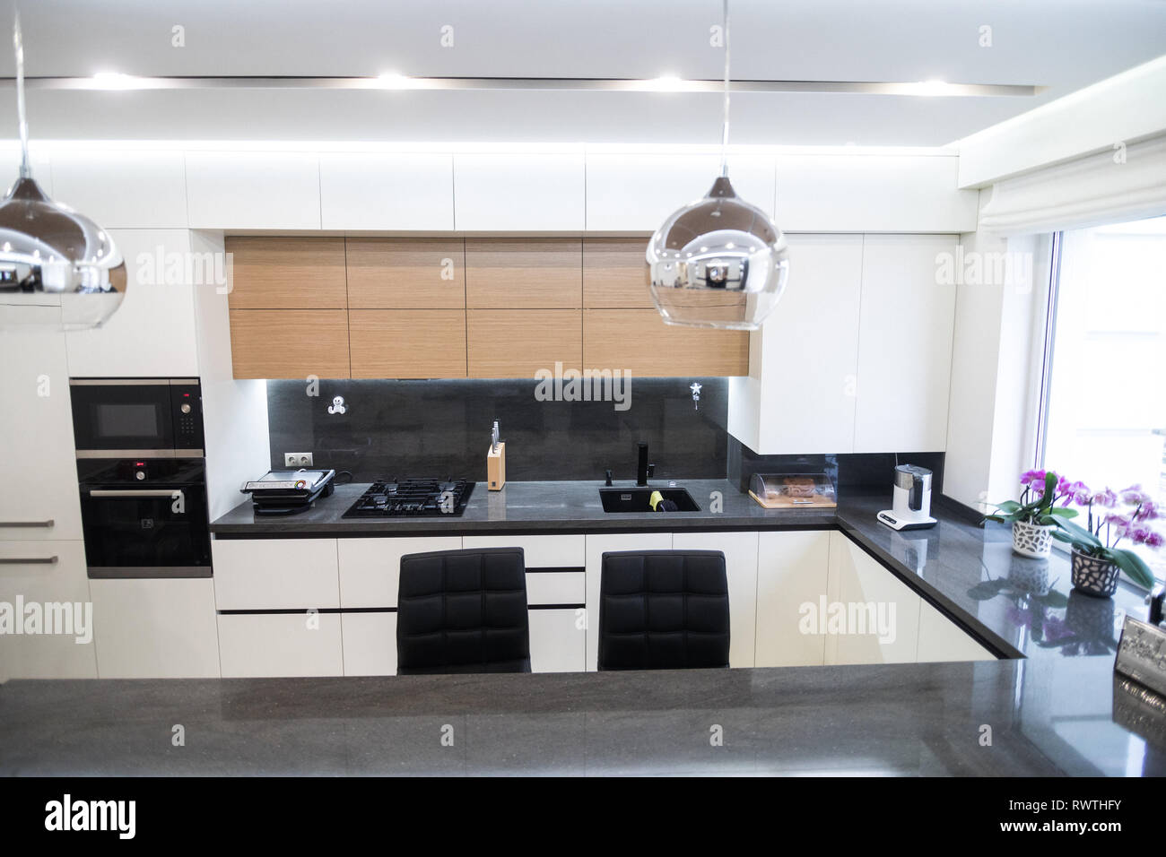 Dark brown modern kitchen interior Stock Photo - Alamy