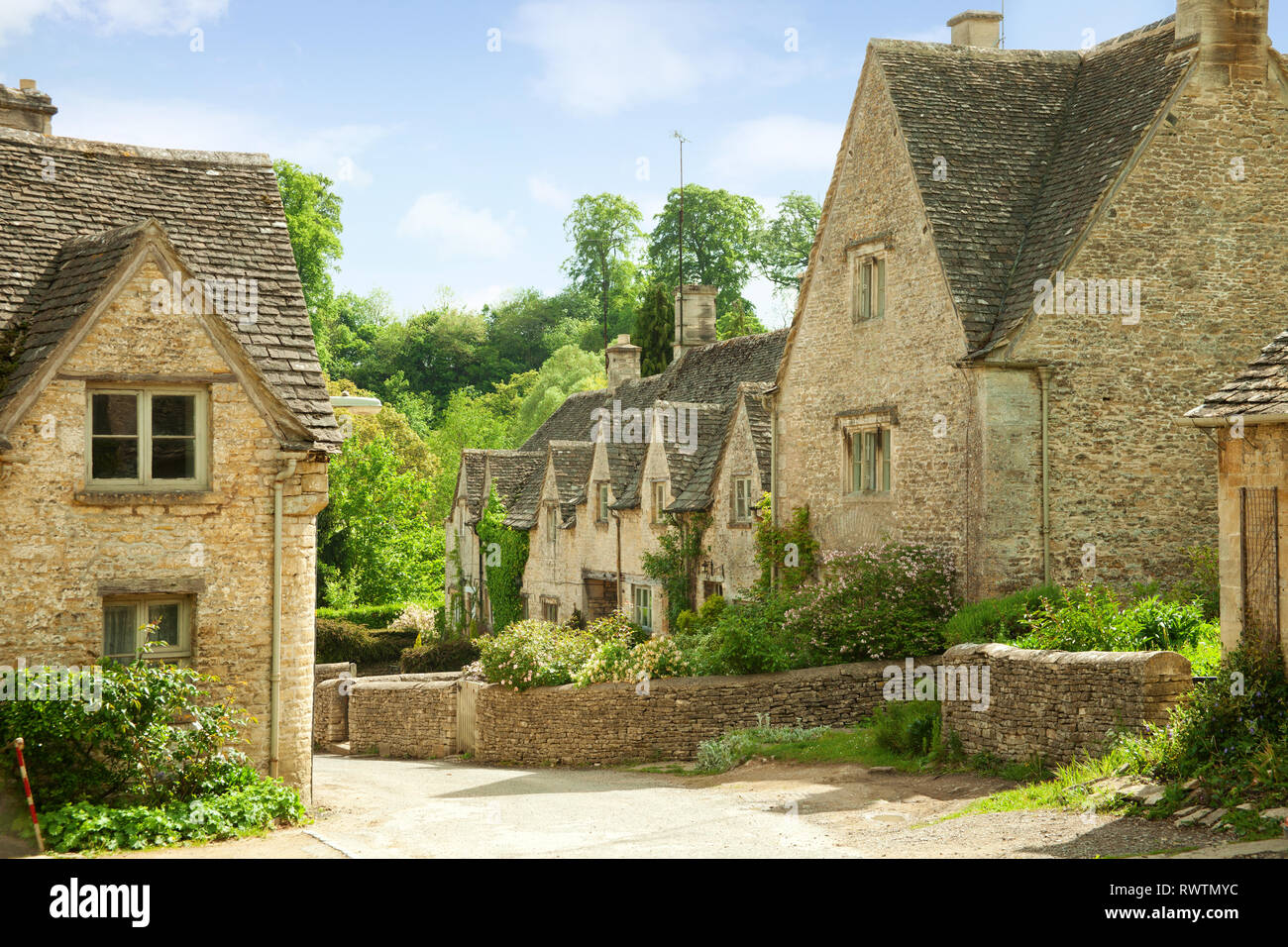 Traditional Cotswold cottages in England, UK. after the rain. spring ...