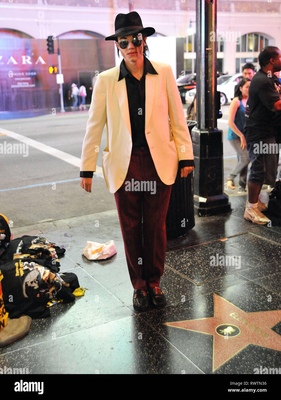 Michael Jackson look a like posing with fans on the Hollywood Blvd. From  all the movie characters in front of the Chinese theatre, MJ look a like,  now, surpass pirate of the