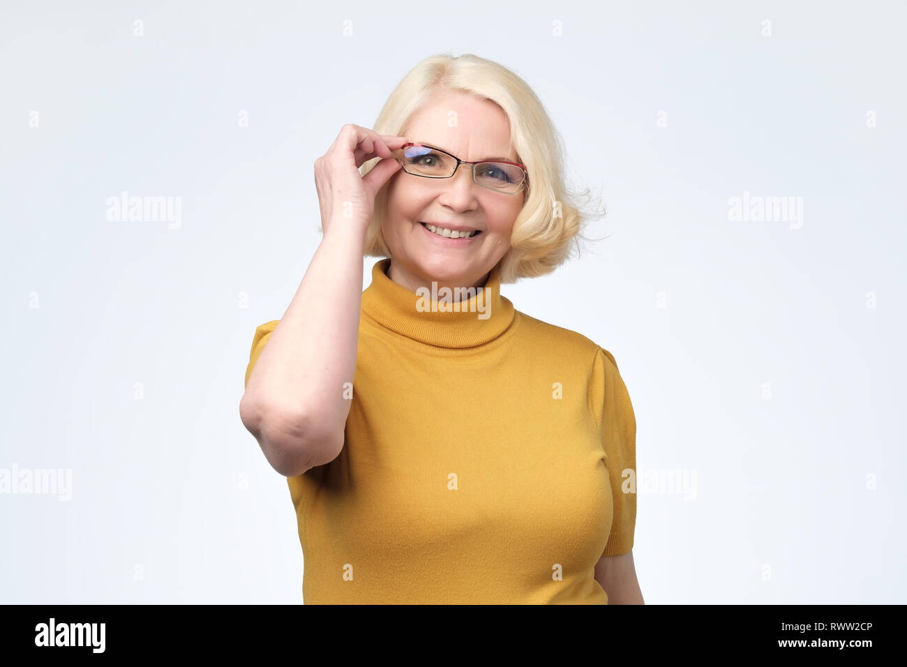 Smiling attractive senior businesswoman wearing glasses head shot ...