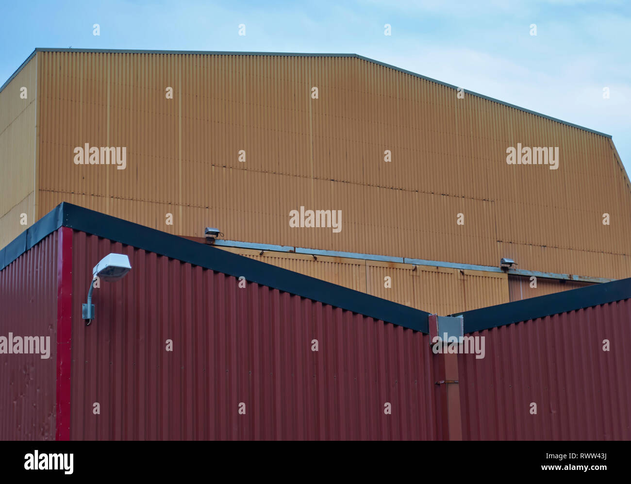 Some of the large galvanised steel covered Ship Buildings at the Batbygg Shipyard in Maloy, Norway used to provide cover for the Vessels. Stock Photo