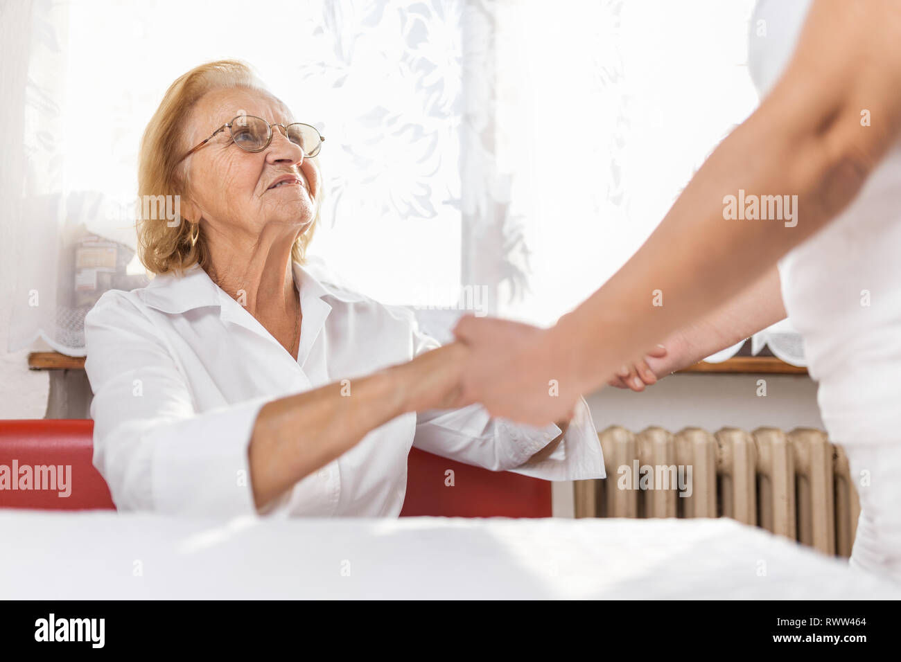 Providing care and support for elderly Stock Photo