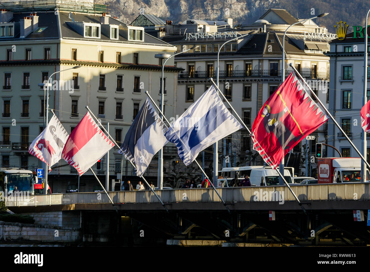 Flags of Swiss cantons fly in the wind, Mont-Blanc Bridge, Geneva ...