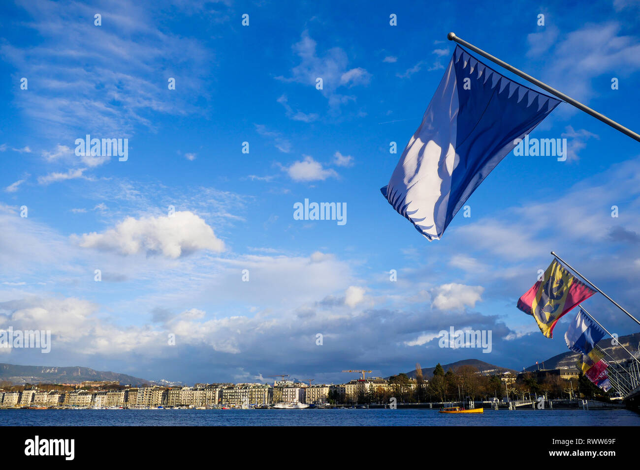 Flags of Swiss cantons fly in the wind, Mont-Blanc Bridge, Geneva ...