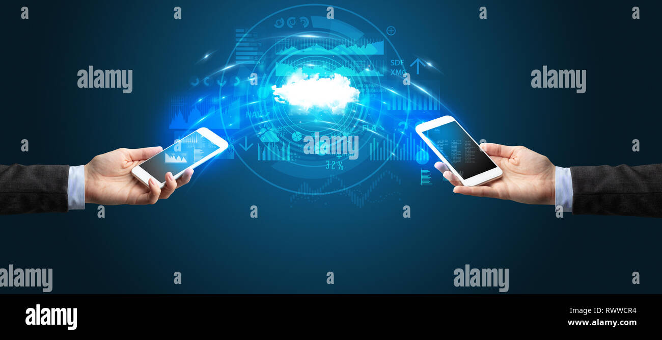 Two mobile phones syncing through the cloud Stock Photo - Alamy