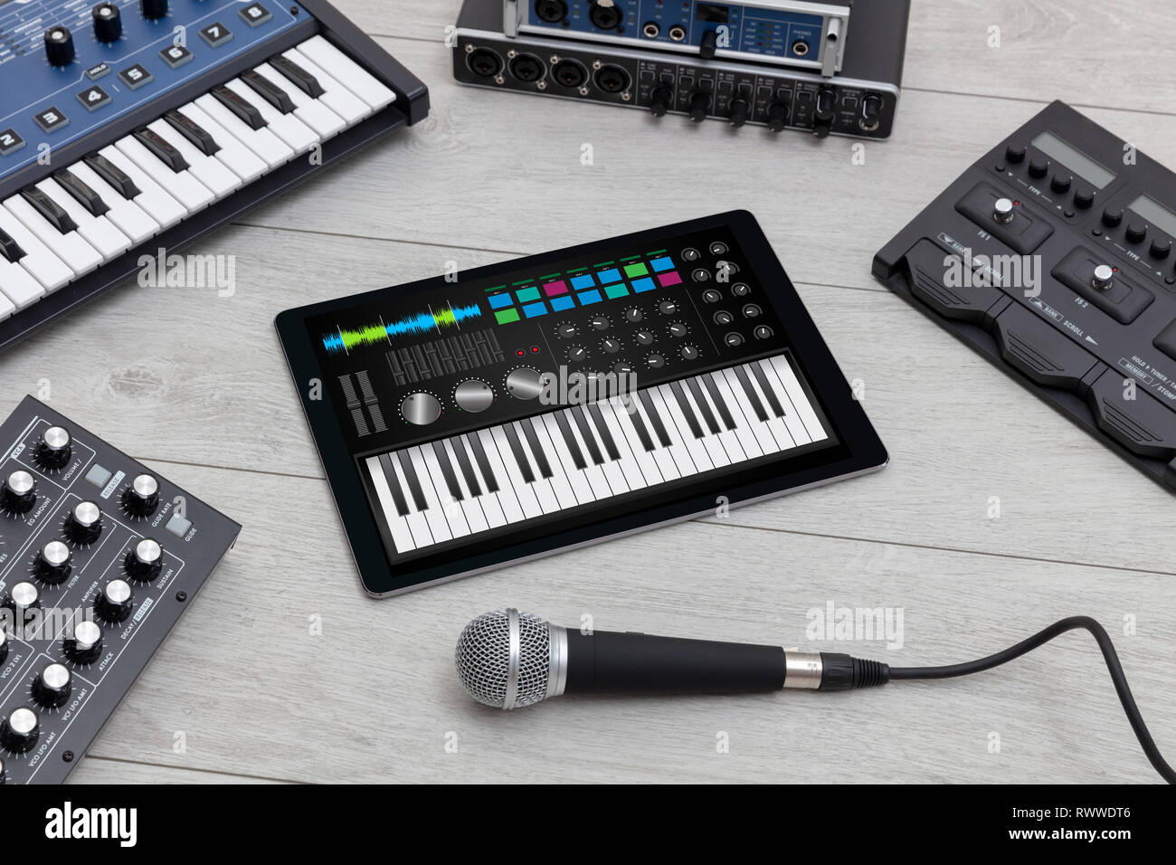 Piano synthesizer app on tablet and musical instrument concept Stock