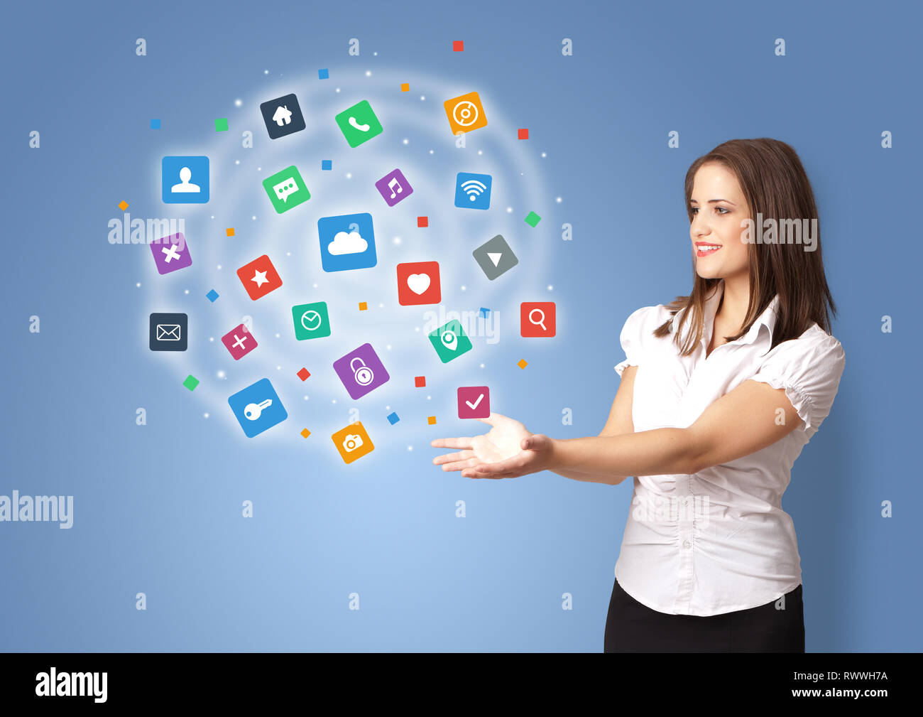 Young person presenting new application icons and symbols Stock Photo ...
