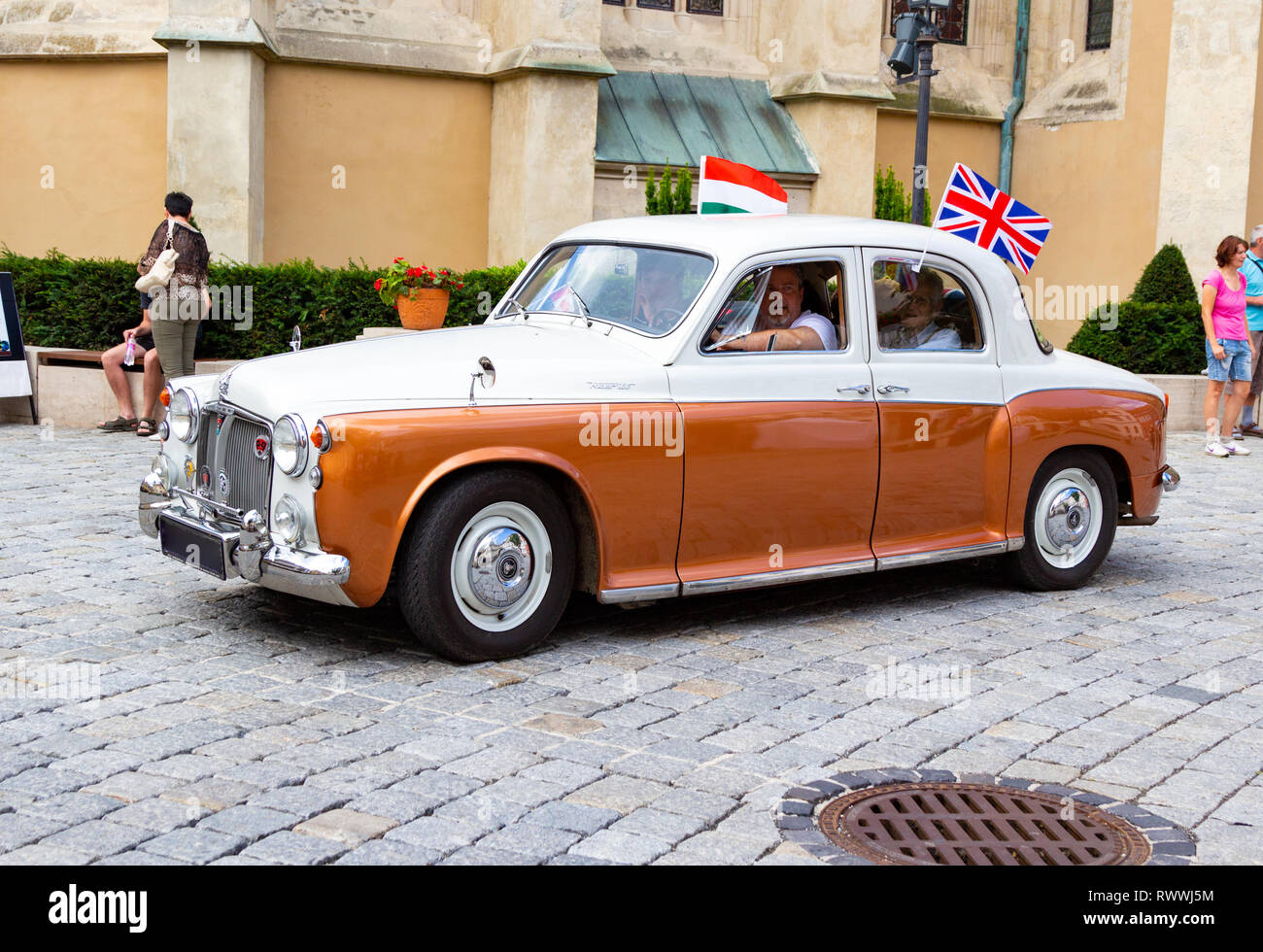 Rover 100 at vintage car show in Sopron, Hungary. Twotone white and beige colour, Hungarian and English flags fixed on the car. Stock Photo