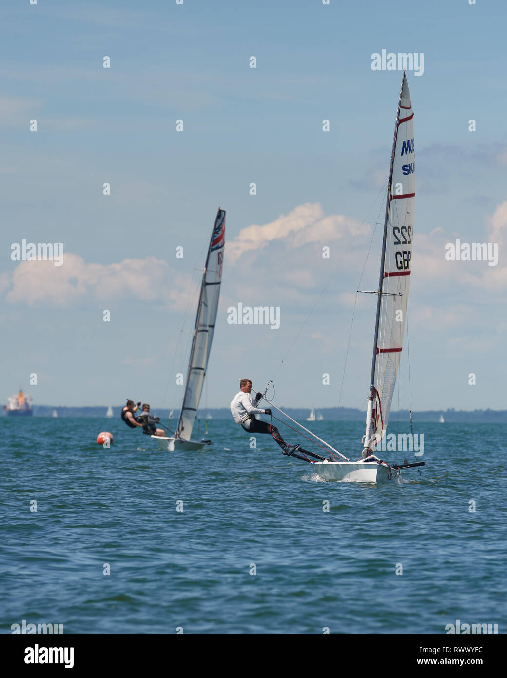 Musto one person trapeze, performance Skiff racing upwind. An exhilaration sport. Stock Photo