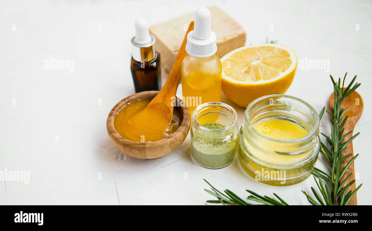Natural organic spa ingredients with manuka honey, essential oil bottle,  clay powder , bath salt, rosemary branches, natural soap, lemon top view  with Stock Photo - Alamy